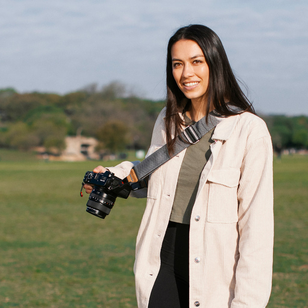 (image), Anne holding her camera with the ash slide around her body wearing it as sling, SL-AS-3, ash