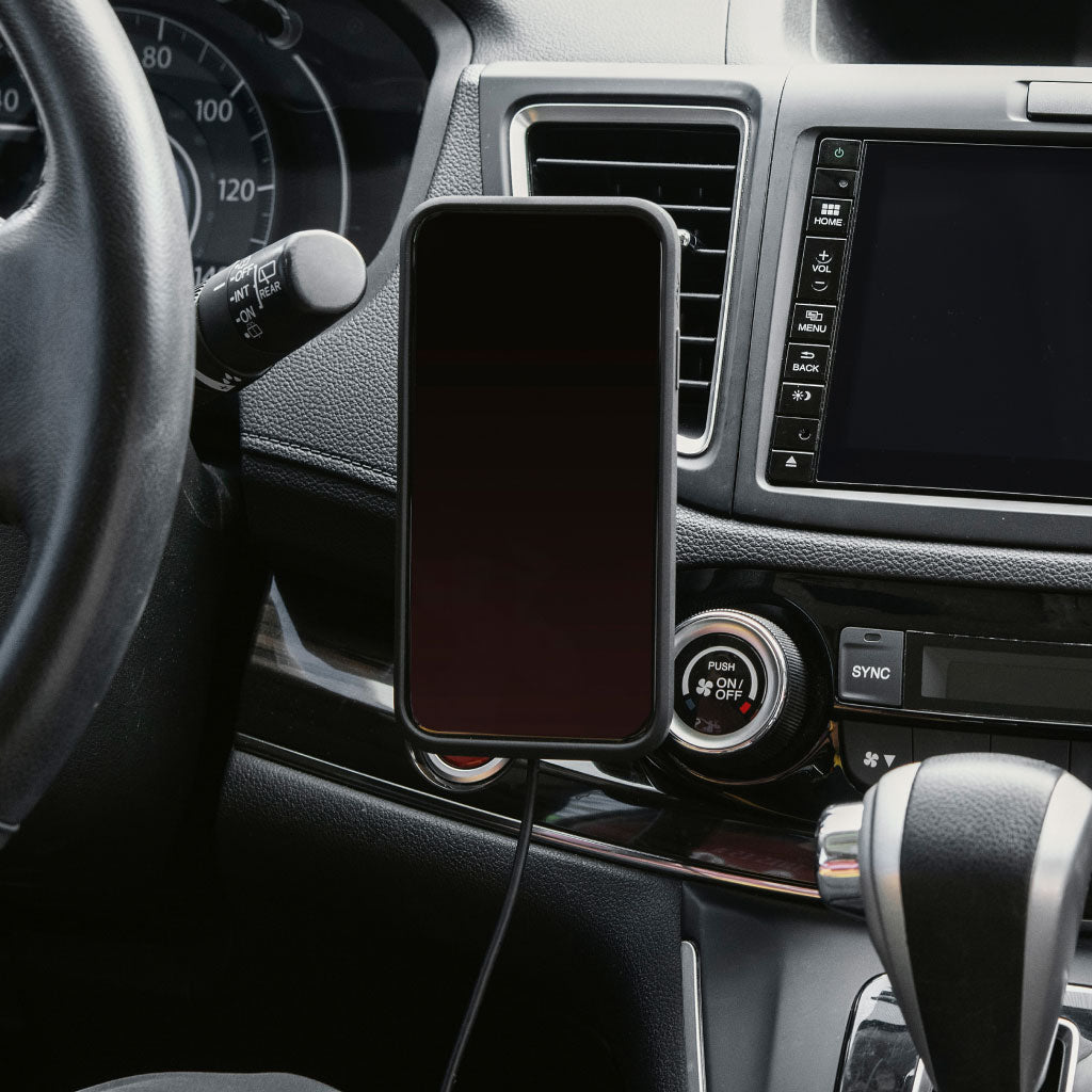 (image), A phone vertically attached to a charging car mount placed below the car's air ventilation,  M-CM-AA-BK-1, M-CM-AA-BK-2