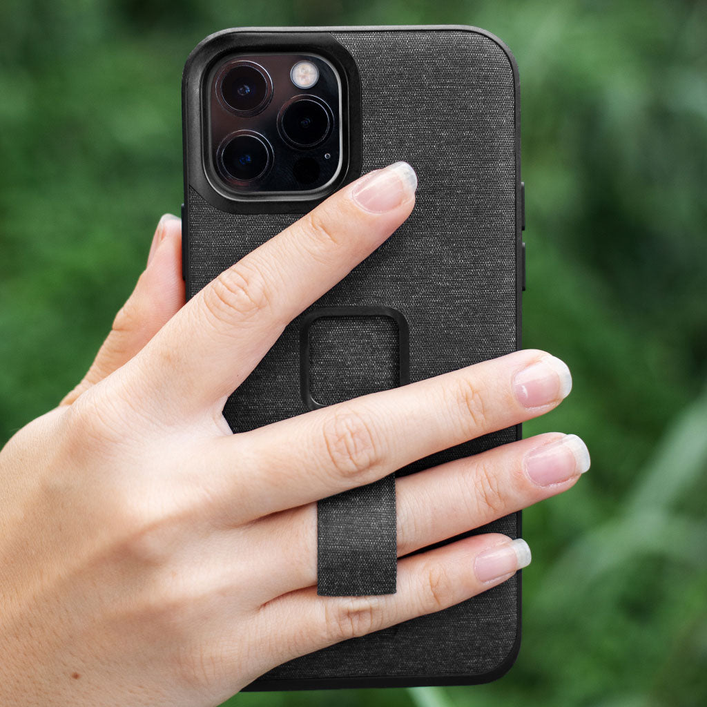 (image), Maria holding his iPhone 12 Pro Max vertically using the finger loop on its Everyday case, M-LC-BJ-CH-1