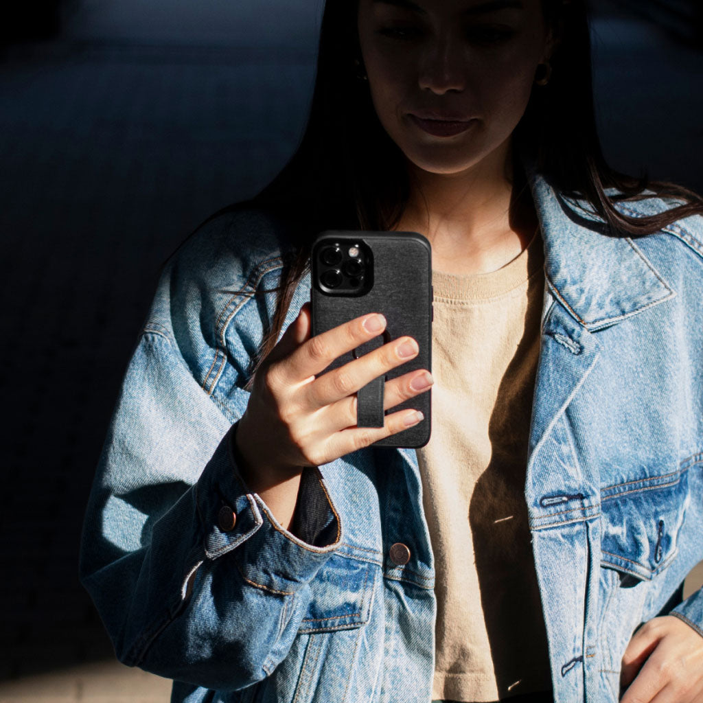 (image), Maria holding his Iphone 13 Pro Max using the finger loop on its Everyday case, M-LC-AS-CH-1, M-LC-AQ-CH-1, M-LC-AG-CH-1, M-LC-AR-CH-1, M-LC-AE-CH-1, M-LC-AE-CH-1, M-LC-AX-CH-1, M-LC-BB-CH-1, M-LC-BC-CH-1, M-LC-BA-CH-1