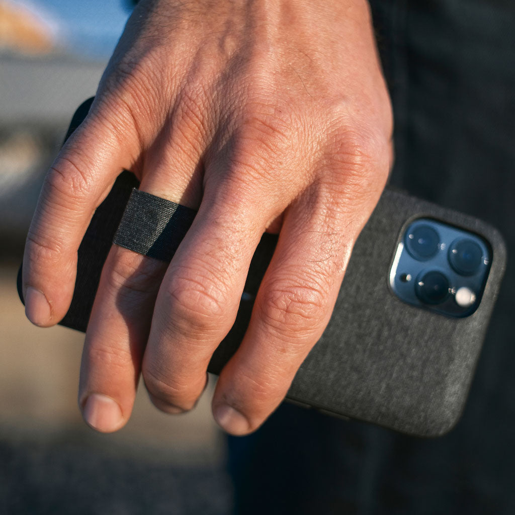 (image), John holding his iPhone 12 Pro Max using its Everyday Case finger loop, M-LC-AX-CH-1, M-MC-AX-SG-1, M-MC-AX-CH-1, M-LC-BB-CH-1