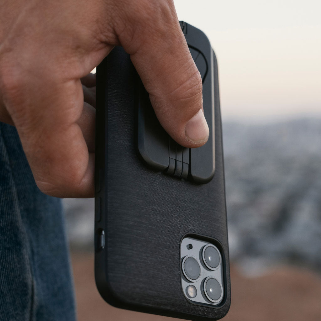 (image), John firmly holding his iPhone with Everyday case and mobile tripod flatten on it,  M-TR-AA-BK-1