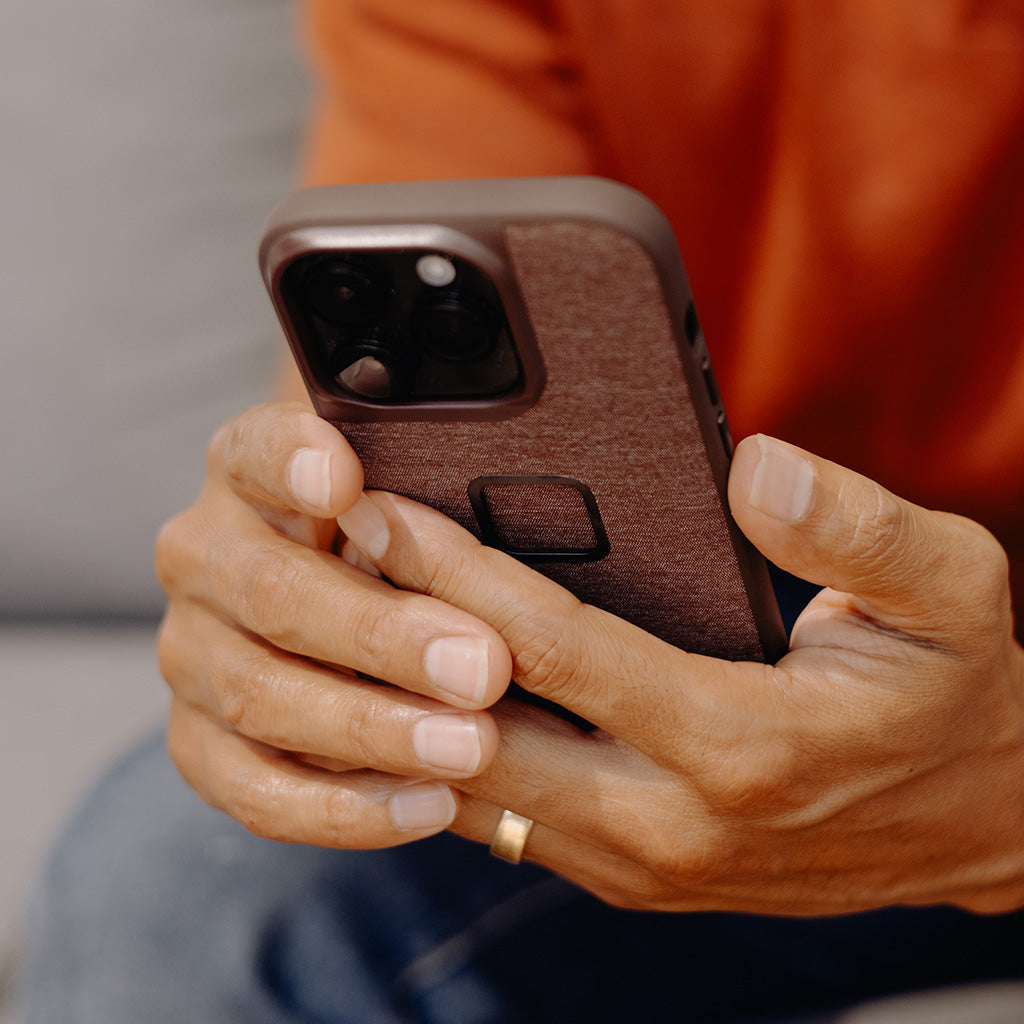 (image), A delighted Maria while holding his iPhone with Everyday Case, M-MC-BL-CH-1, M-MC-BL-MN-1, M-MC-BL-SG-1, M-MC-BL-SN-1, M-MC-BL-RD-1