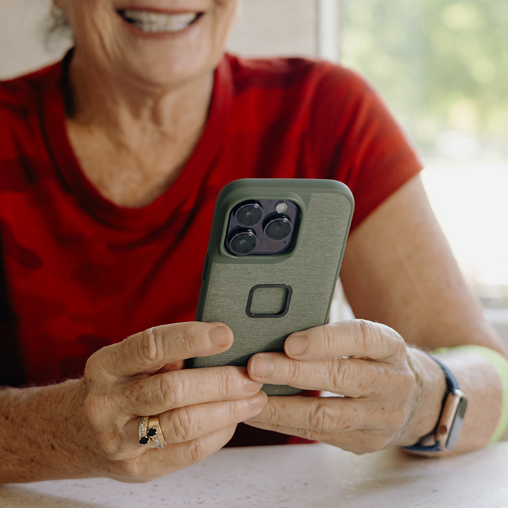 (image), Maria holding her iPhone with Everyday Case, M-MC-BJ-CH-1, M-MC-BJ-MN-1, M-MC-BJ-SN-1, M-MC-BJ-RD-1, M-MC-BJ-SG-1