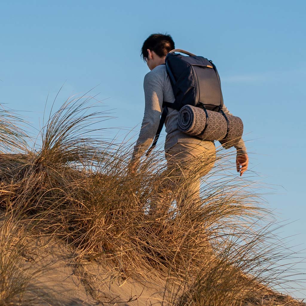 (image), Alvin carrying his everyday backpack with a blanket attached to the external carry straps, BEDB-20-MN-2, BEDB-30-MN-2, midnight