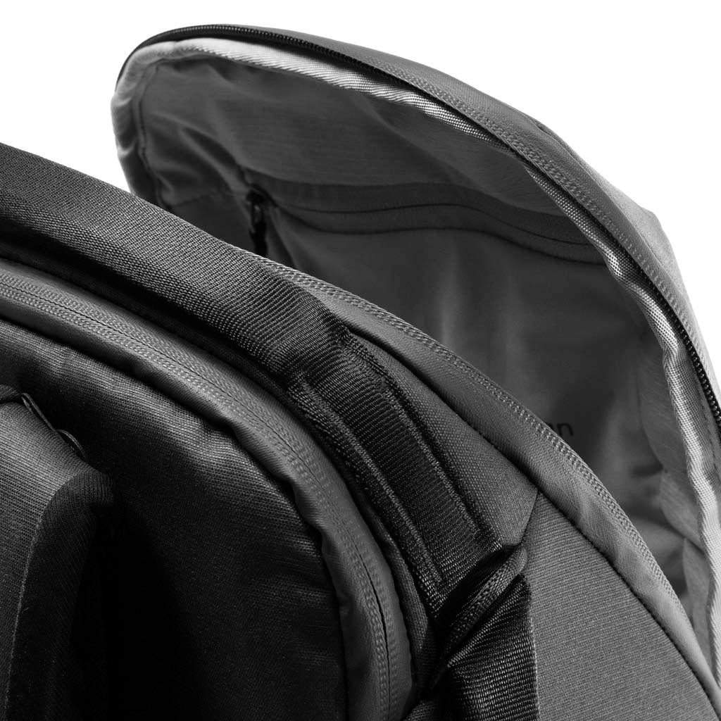 black, Top access of the black backpack zip with internal pocket inside