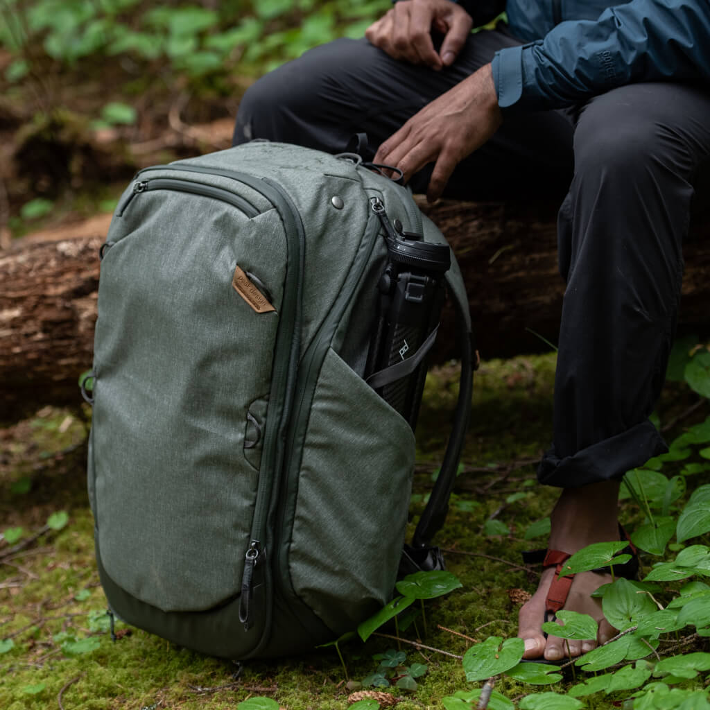 (image), Elish sitting on a fallen tree in the woods with his the sage travel bag, BTR-45-SG-1, sage