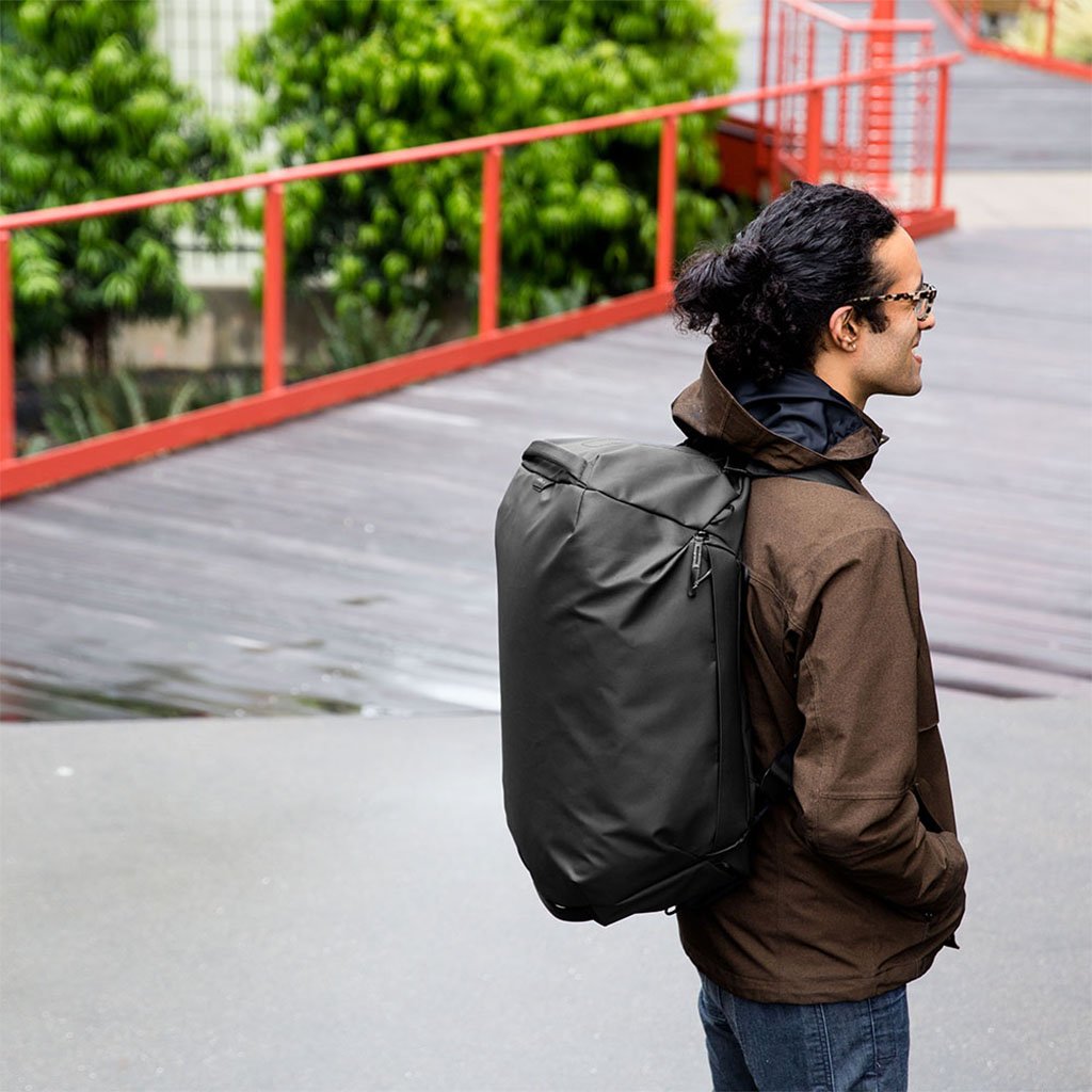 (image), Alvin carrying the duffel bag on his back through the shoulder strap, BTRD-35-BK-1, black