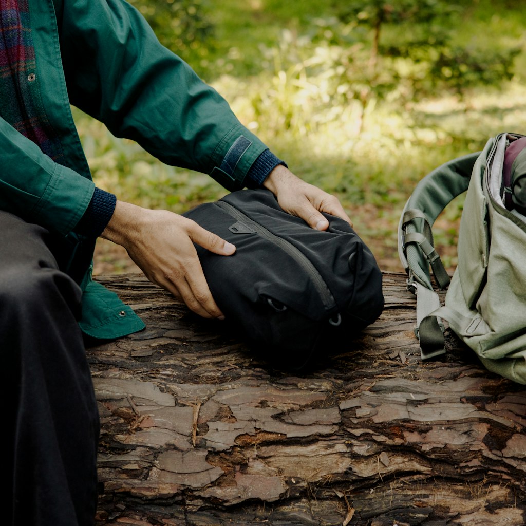 (image), holding black ultralight packing cube inside a bag, BUP-BK-XXS-1, BUP-BK-XS-1, BUP-BK-S-1, hover-img